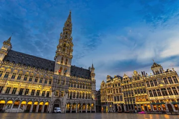 Poster Brussels Belgium, night city skyline at famous Grand Place town square © Noppasinw