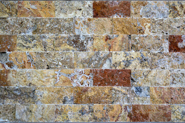 Various colored decorative stone cladding plates natural stones on the wall. Colorful natural stone...