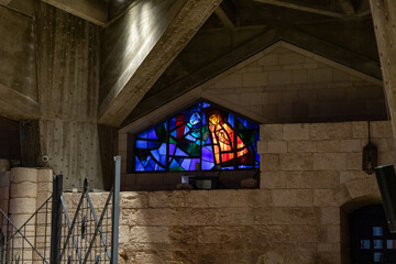Religious stained glass windows in the of Church Of Annunciation - built in 1969 on the spot where...