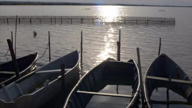 Time lapse on lake lesina, small fishing boats, molise italy