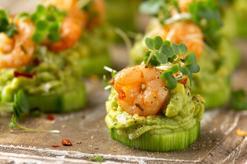 Canape with prawn, cucumber and avocado guacamole, party food, finger food - obrazy, fototapety, plakaty