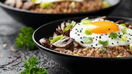 Bowl of Buckwheat with mushrooms, onion and egg. Healthy food