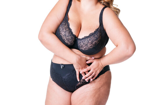 Fat woman in black lingerie, overweight female body isolated on white background