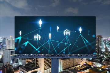 Glowing Social media icons on billboard over night panoramic city view of Bangkok. The concept of networking and establishing new connections between people and businesses in Southeast Asia