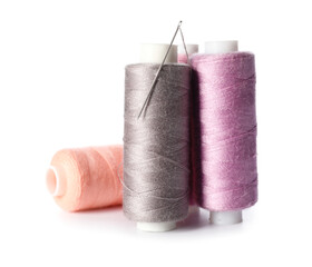 Beautiful sewing threads on white background