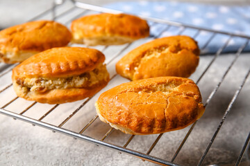 Grid of tasty sochniki with cottage cheese on grey background, closeup