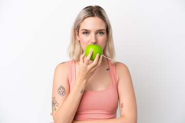 Young caucasian woman isolated on white background eating an apple