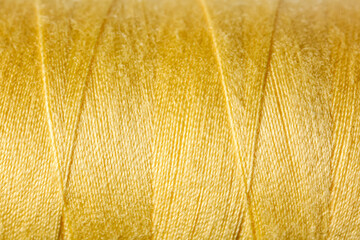 Closeup view of yellow threads as background