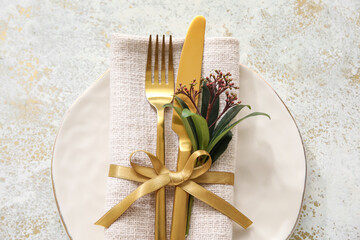 Stylish simple table setting and flowers on light background