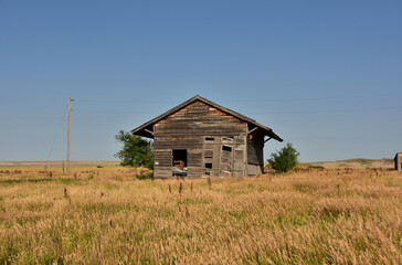 Fototapeta premium Deserted Weathered Wooden Building in a Ghost Town
