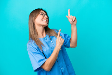 Middle age surgeon woman isolated on blue background pointing with the index finger a great idea