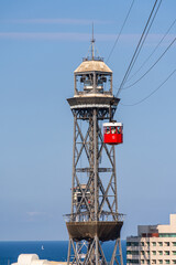 Fototapeta na wymiar Red cabin of cable car in Barcelona, Catalonia, Spain