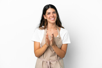 Restaurant waiter over isolated white background applauding after presentation in a conference