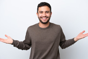 Fototapeta premium Young Brazilian man isolated on white background with shocked facial expression