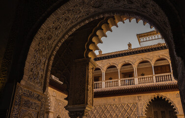 Seville, Spain, September 12, 2021: Royal Palace of Seville (Real Alcazar). The Maidens Courtyard. The Mudejar of Pedro I on the ground floor and the Renaissance of the first monarchs.