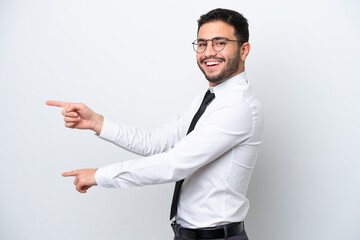 Business Brazilian man isolated on white background pointing finger to the side and presenting a product