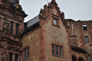 Large ancient castle in a German city. The castle is decorated with various figures. Vintage for postcards.