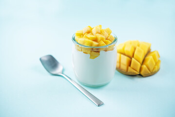 Greek yogurt mango parfait in jars