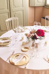table setting for a wedding celebration with flowers