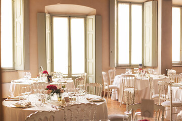 Summer Wedding Tables in Ceremony hall, in Lombardy, Italy, with chairs and windows
