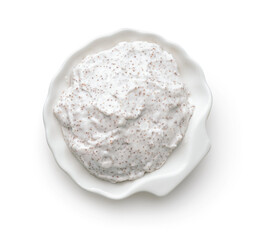 Top view of exfoliating body scrub in white ceramic cup