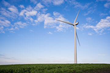 Wind turbine generating renewable energy on a clear windy day