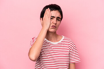 Young caucasian woman isolated on pink background tired and very sleepy keeping hand on head.