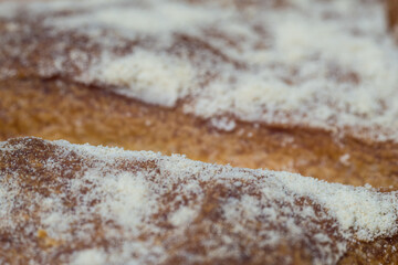 Round loaf of bread, cooked with your own hands in the oven, beautiful crust, lush structure.