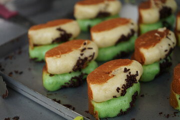 Kue pukis is a cake made from flour dough and cooked in a special mold pan. This cake is made from a mixture of eggs, sugar, wheat flour, yeast and coconut milk.