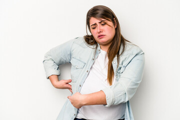 Young caucasian overweight woman isolated on white background having a liver pain, stomach ache.