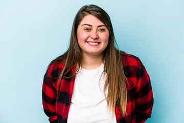 Young caucasian overweight woman isolated on blue background happy, smiling and cheerful. - obrazy, fototapety, plakaty