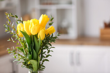 Bouquet of beautiful flowers in kitchen, closeup