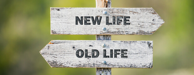 opposite signs on wooden signpost with the text quote new life old life engraved. Web banner format.
