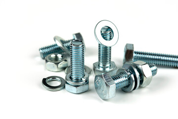 metal bolts and nuts with round washers close-up on a white background