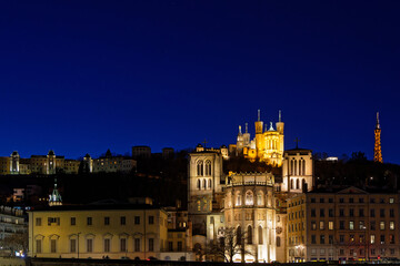 Fototapeta na wymiar LYON, FRANCE, February 19, 2022 : Fourviere hill at the blue hour, with Saint-Jean Cathedral and Fourviere basilica.