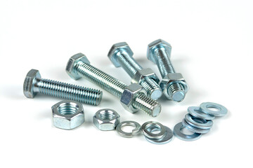 metal bolts and nuts with round washers close-up on a white background