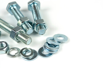 metal bolts and nuts with round washers close-up on a white background. copy space