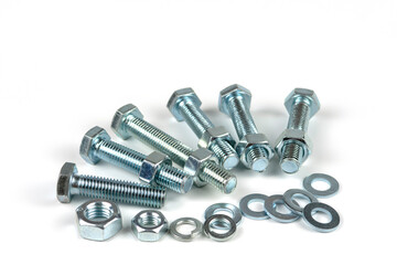 metal bolts and nuts with round washers close-up on a white background