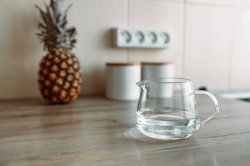 A glass of fresh water in crafin modern kitchen.