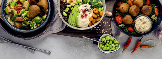 Vegan dishes assortment on light background.