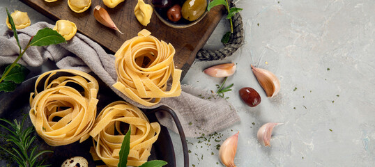 Italian pasta assortment on light background.