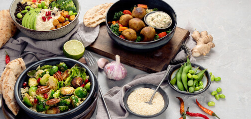 Vegan dishes assortment on light background.