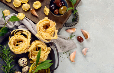 Fototapeta na wymiar Italian pasta assortment on light background.
