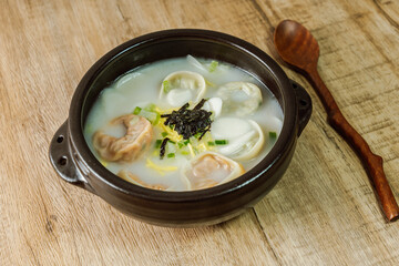 tteok mandu guk, Korean style dumpling soup with sliced rice cake