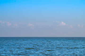 Blue Sea Ocean under blue sky with fluffy white cloud seascape nature background summer travel vacation