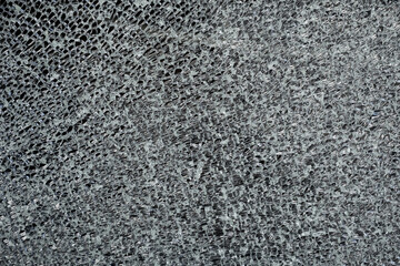 Cracked tempered glass with cracks pattern. Vandalism, destruction concept.