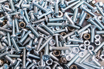 Metal bolts and nuts closeup, background or texture