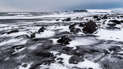Famous black beach in winter storm