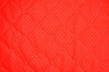 red background of checkered fabric