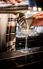 man hand bartender making cocktail on the bar counter
